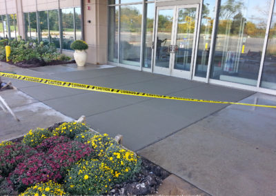 concrete sidewalk at building entrance