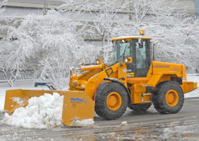 Snow Plow clearing a drive