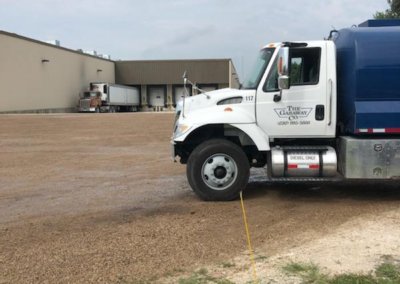 Gasaway Maintenance tank truck on site applying dust suppressant