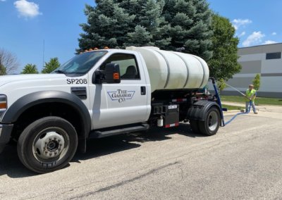 Landscape truck watering parkway trees and plantings in Romeoville Il