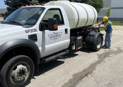 Landscape water truck watering parkway trees in Romeoville Illinois