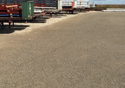 Gravel yard treated with dust suppressant