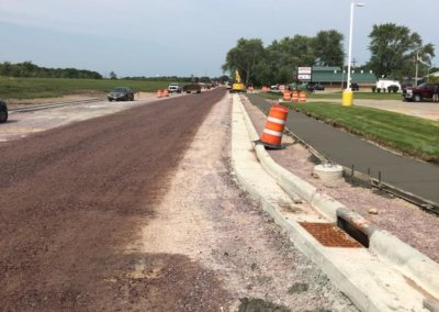 Road base treated with dust suppressant prior to paving