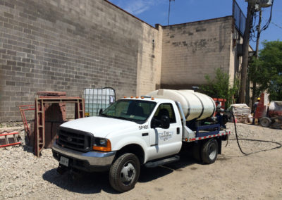Water truck delivering water to construction site in Chicago