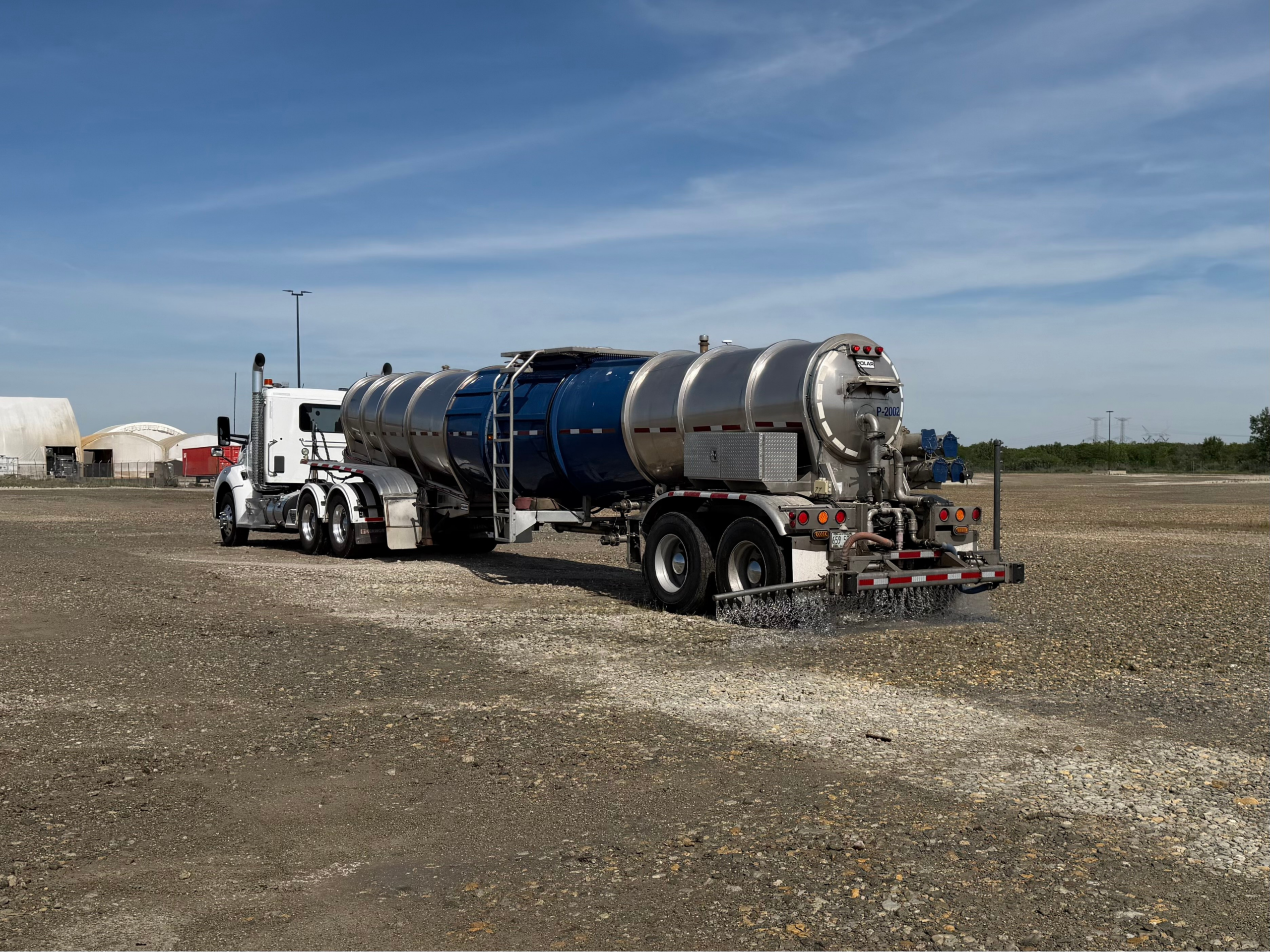 A Gasaway Maintenance Company 6,000 gallon semi truck spraying dust control at Centerpoint Intermodal Center in Elwood, IL.