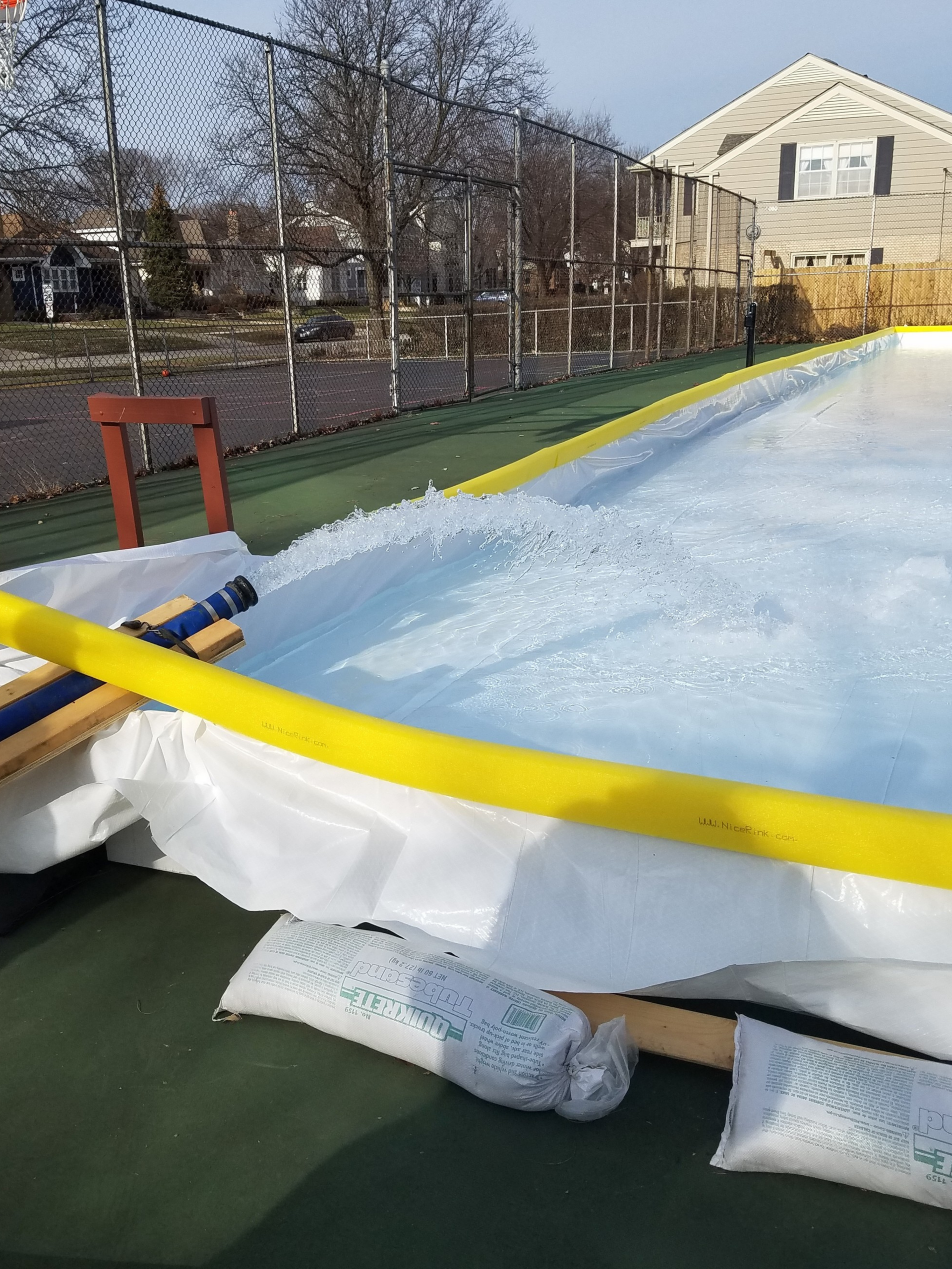 An ice rink being filled with water delivered by Gasaway Maintenance Company.