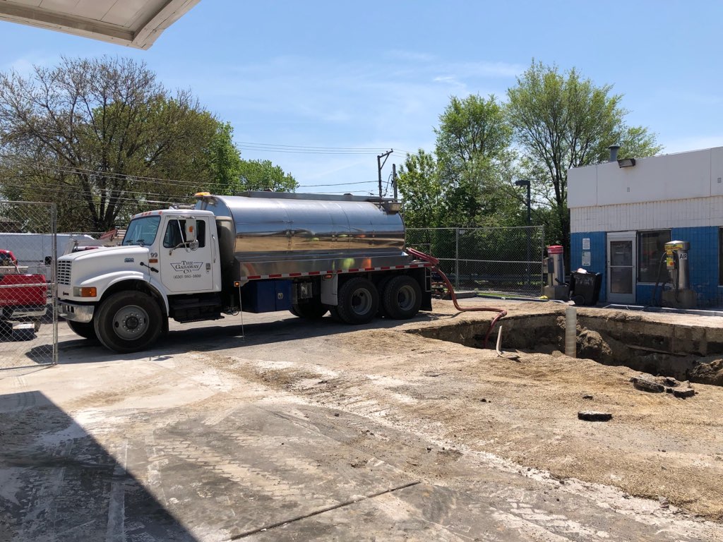 A Gasaway Maintenance Company smaller water truck at a construction site in Lisle, IL, to provide water for an underground tank filling job.